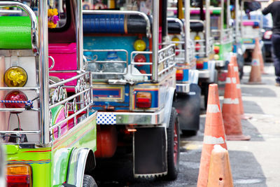 Close-up of jinrikisha on street