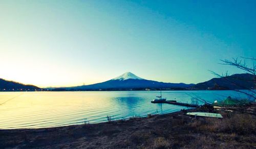 Scenic view of calm lake against clear sky