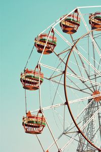 Low angle view of ferris wheel against clear sky