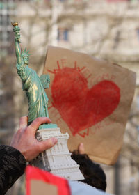 Close-up of hand holding statue of liberty