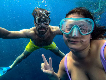 Portrait of man swimming in sea