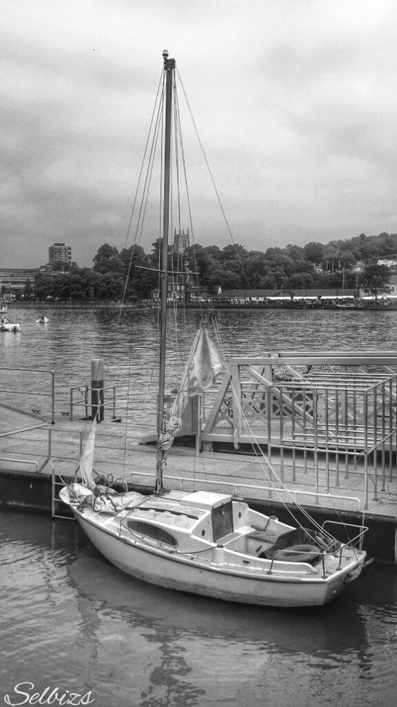 nautical vessel, transportation, boat, mode of transport, water, moored, sky, waterfront, mast, sailboat, sea, cloud - sky, river, travel, harbor, built structure, sailing, architecture, cloud, outdoors