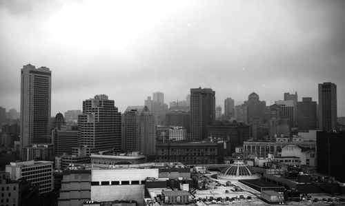 High angle view of buildings in city against sky
