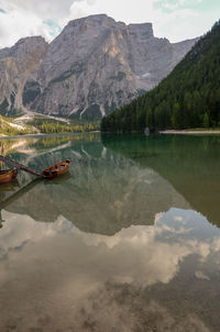 Scenic view of lake and mountains against sky