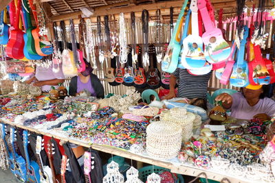 Clothes hanging in store for sale at market stall