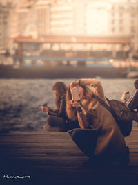 Woman photographing with mobile phone