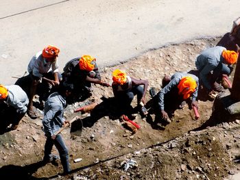 High angle view of people working on street