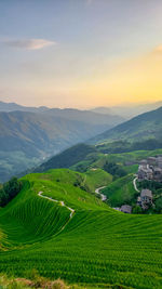 Twilight in mountains after sunset. village on slopes. wonderful view.