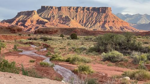 Rock formations on landscape against sky