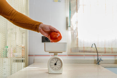 Man hand on wall at home