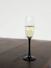 Close-up of wine in glass on table