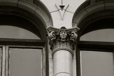 Low angle view of sculpture on building