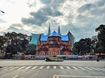 View of buildings against cloudy sky