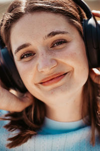 Close-up of young woman using mobile phone