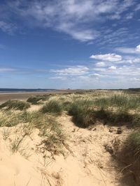 Scenic view of beach against sky