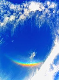 Low angle view of rainbow in sky