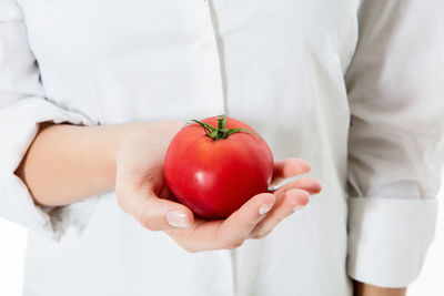 Close-up of hand holding apple