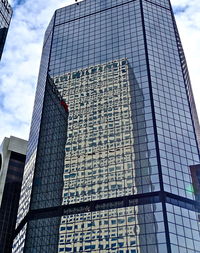 Low angle view of modern building against sky