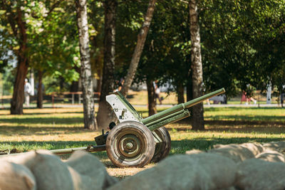 Close-up of machine part in forest