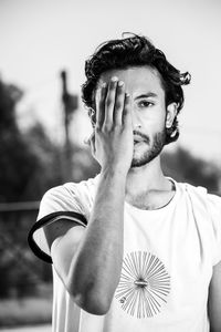 Portrait of young man standing outdoors