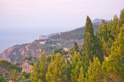 Panoramic view of sea and mountain against sky