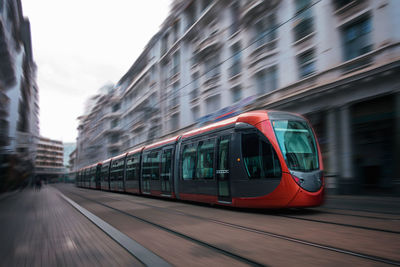 Tram on street in city