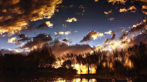 Scenic view of lake at sunset