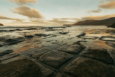 Scenic view of sea against cloudy sky