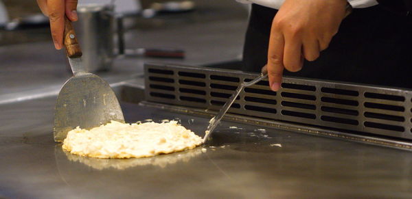 Close-up of person preparing food