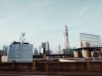 Modern buildings in city against sky