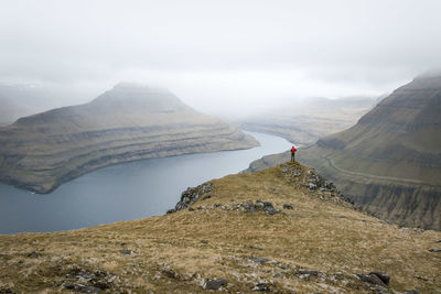 Scenic view of mountains against cloudy sky