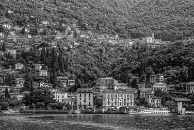 Scenic view of river by buildings in city