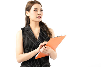 Beautiful woman standing against white background