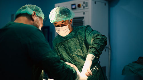 Team of surgeons doing an operation. sterile operating room.