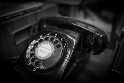 Close-up of telephone on table