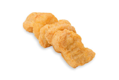 High angle view of bread in plate against white background