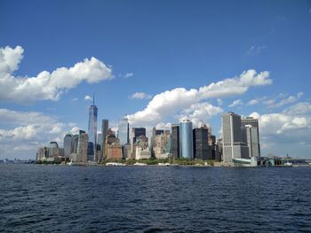 Manhattan skyline on sunny day seen from hudson river