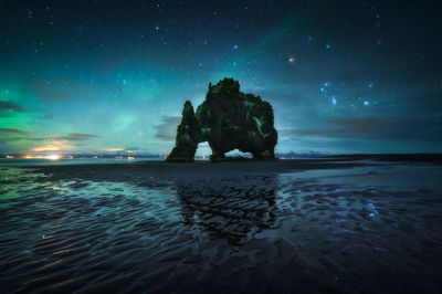 Scenic view of sea against sky at night