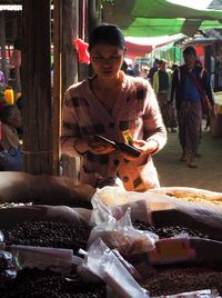 Man holding food at market stall