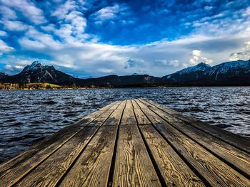 Pier over lake against sky