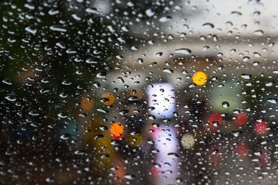 Full frame shot of wet glass window in rainy season