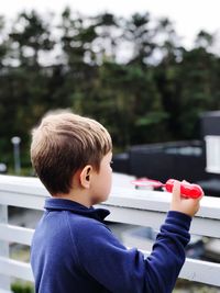 Boy holding bubble wand