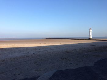 Scenic view of beach against clear sky