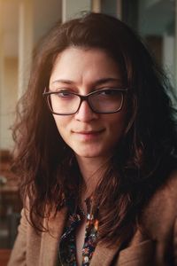 Close-up portrait of smiling young woman