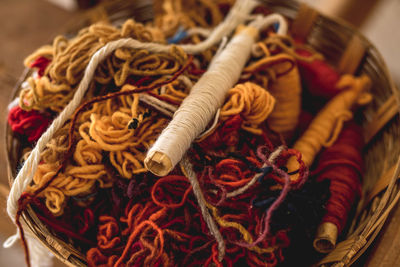 Close-up of wools and thread in basket