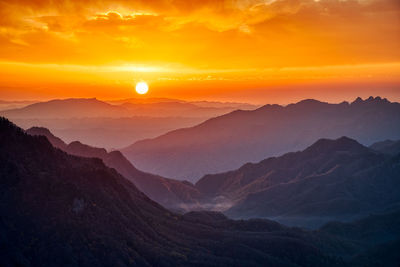 Scenic view of mountains against sky during sunset