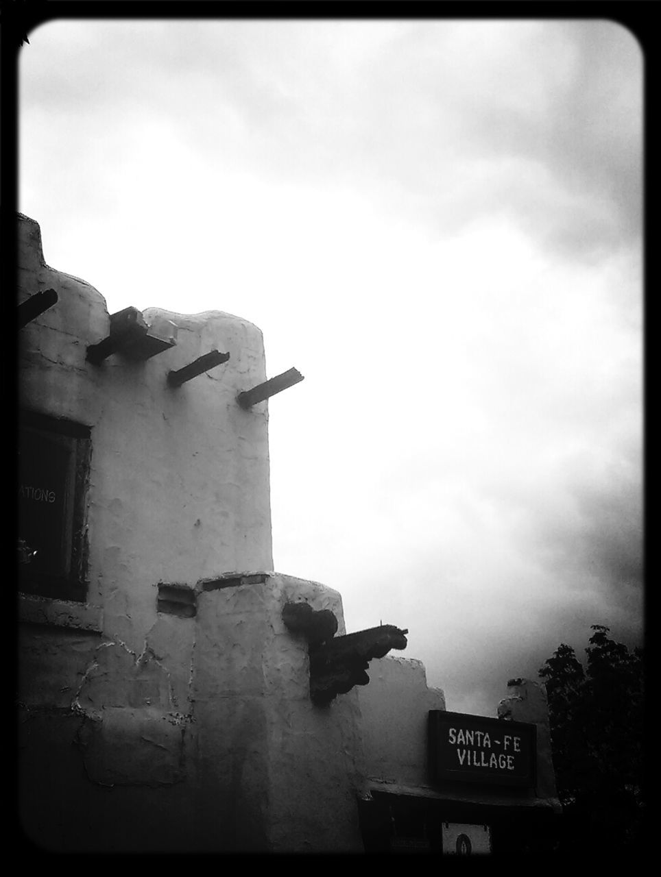 transfer print, building exterior, architecture, built structure, auto post production filter, sky, low angle view, cloud - sky, text, cloud, history, outdoors, cloudy, old, day, western script, dusk, no people, building, communication