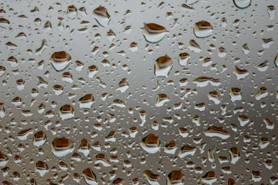 Full frame shot of wet glass