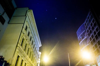 Low angle view of buildings against blue sky