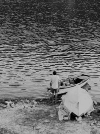 High angle view of men fishing at beach